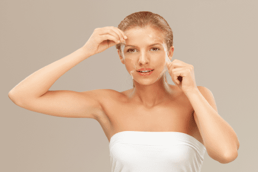 Woman Peeling off Her Facemask